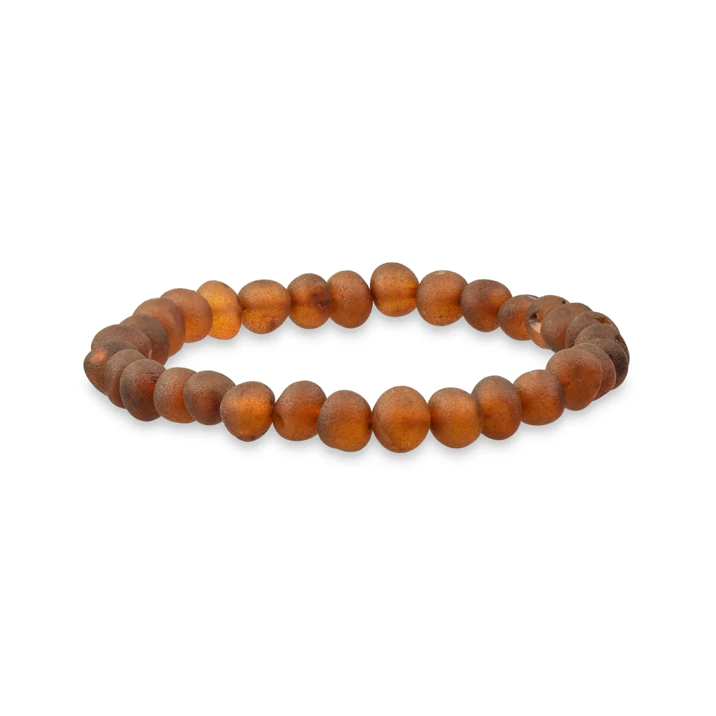 Handmade amber beaded bracelet with matte finish, earthy tones, and elastic for versatile wear.