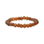 Handmade amber beaded bracelet with matte finish, earthy tones, and elastic for versatile wear.