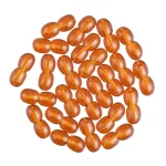 Collection of translucent amber oval beads arranged in a circular, decorative pattern with glossy finish.