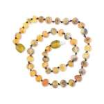 Polished teething amber necklace light green color