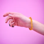 Polished honey color bracelet on elastic thread