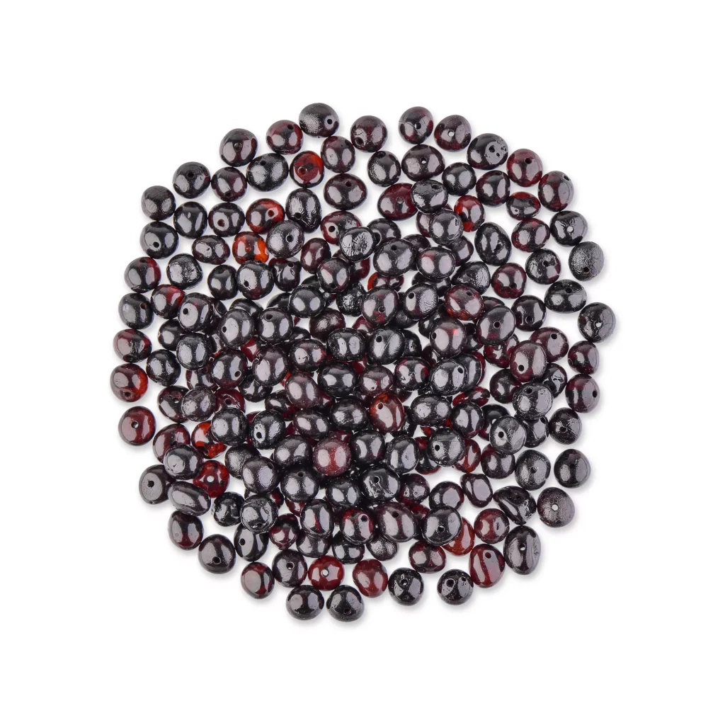 Circular arrangement of glossy deep red and black Baltic amber beads, handcrafted jewelry.