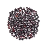 Circular arrangement of glossy deep red and black Baltic amber beads, handcrafted jewelry.