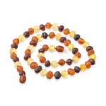 Multicolor polished amber beads strand, natural Baltic resin jewelry, elegant and handcrafted accessory.