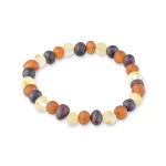 Colorful Baltic amber beaded bracelet with organic shapes on elastic for versatile, natural style.