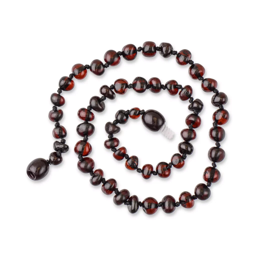 Handmade Baltic amber necklace with natural reddish-brown beads, elegant and versatile jewelry piece.