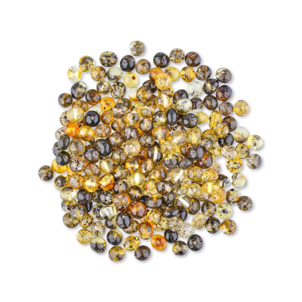 Collection of polished amber beads in warm gold and honey tones, ideal for jewelry and accessories.