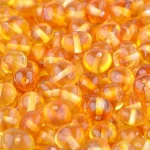 Shimmering amber beads with warm honey tones, perfect for jewelry and creative crafts.