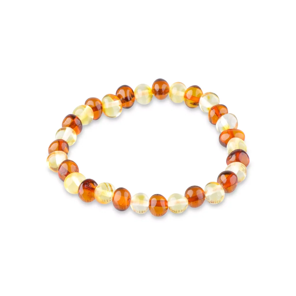 Handcrafted Baltic amber beaded bracelet with warm amber and cream tones on elastic stretch.