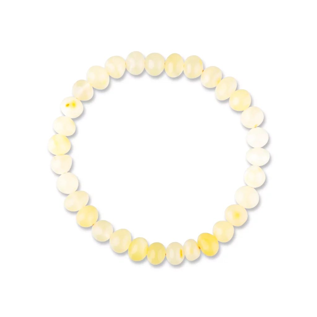 Elegant pastel yellow and white beaded bracelet with polished, semi-translucent stones on elastic thread.