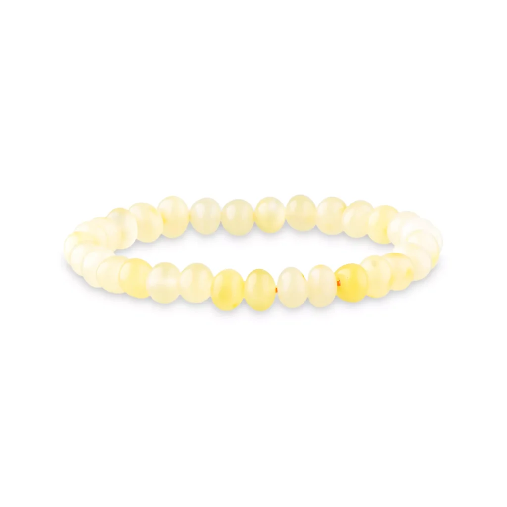 Yellow beaded elastic bracelet with polished Baltic amber, elegant, versatile, and perfect for everyday wear.
