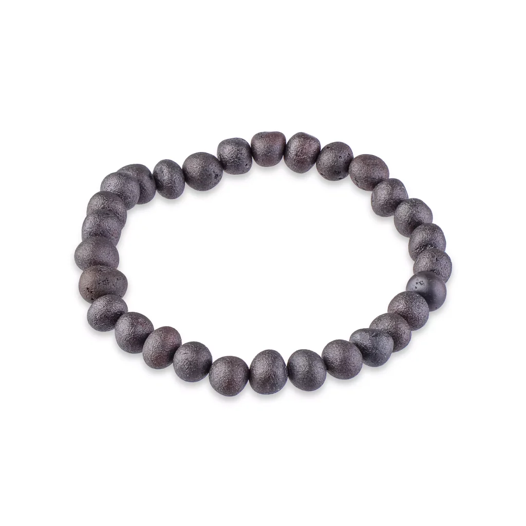 Rustic dark wooden beaded bracelet on elastic cord, versatile and naturally stylish accessory.