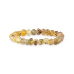 Handmade amber beaded bracelet with natural yellow, amber, and brown tones on elastic thread.