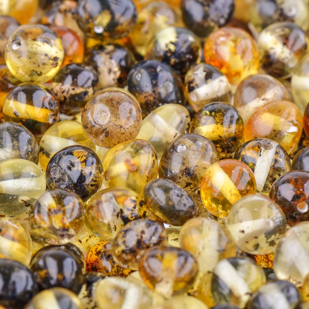 Beautiful amber beads with natural inclusions and rich, warm, glossy tones for jewelry and crafts.