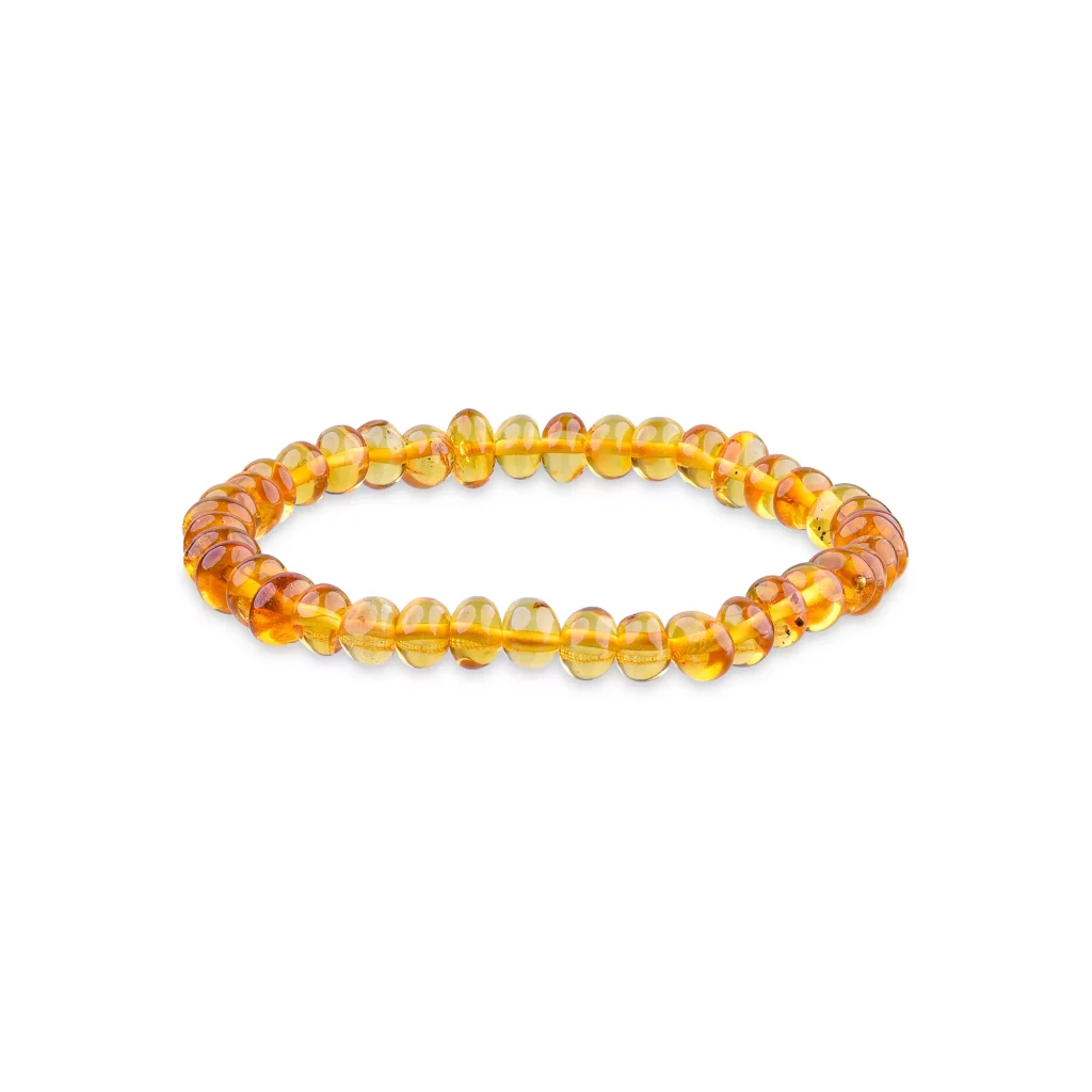 Elegant amber beaded bracelet with polished, warm-toned Baltic amber on stretch elastic.