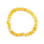 Warm yellow Baltic amber bracelet with polished beads on elastic, perfect for stylish everyday wear.