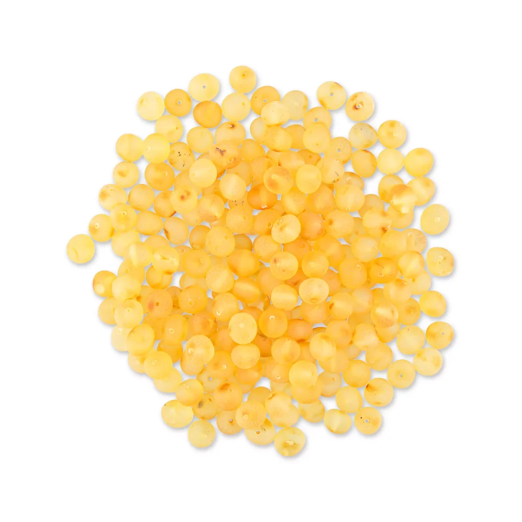 Bright yellow handmade Baltic amber beads for jewelry and craft projects.