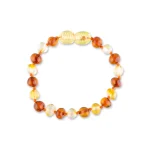 Elegant Baltic amber bracelet with colorful, polished beads showcasing natural warmth and craftsmanship.
