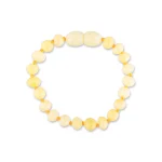 Soft yellow beaded bracelet with oval and round polished beads, stretchy and elegant for everyday wear.