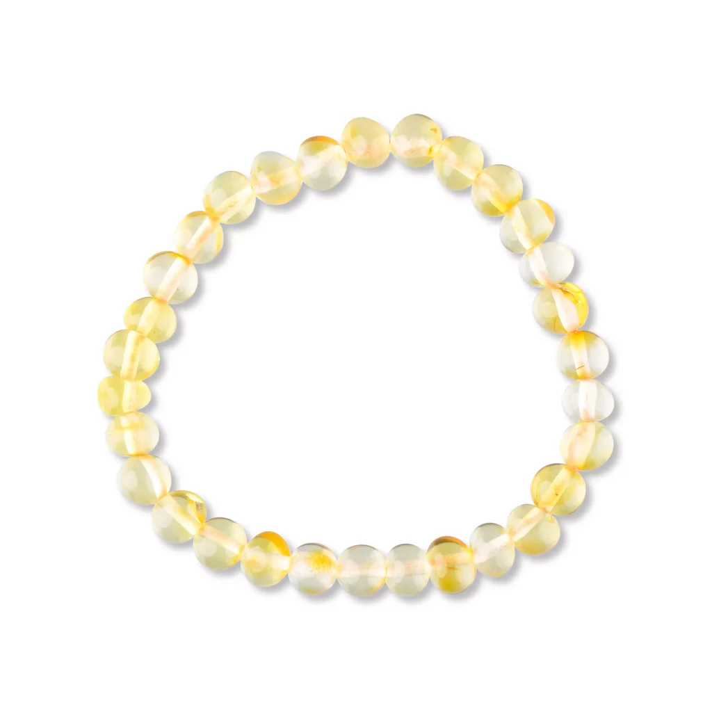 Luminous yellow translucent bead bracelet, elegant handmade jewelry with polished, uniform beads on elastic cord.