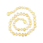 Elegant golden Baltic amber necklace with sparkling, handcrafted beads and a graceful, versatile design.
