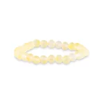 Soft yellow beaded stretch bracelet with polished, calming, and elegant design for any occasion.
