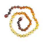 Amber prayer beads with warm gradient tones and polished, textured gemstones for meditation and spirituality.