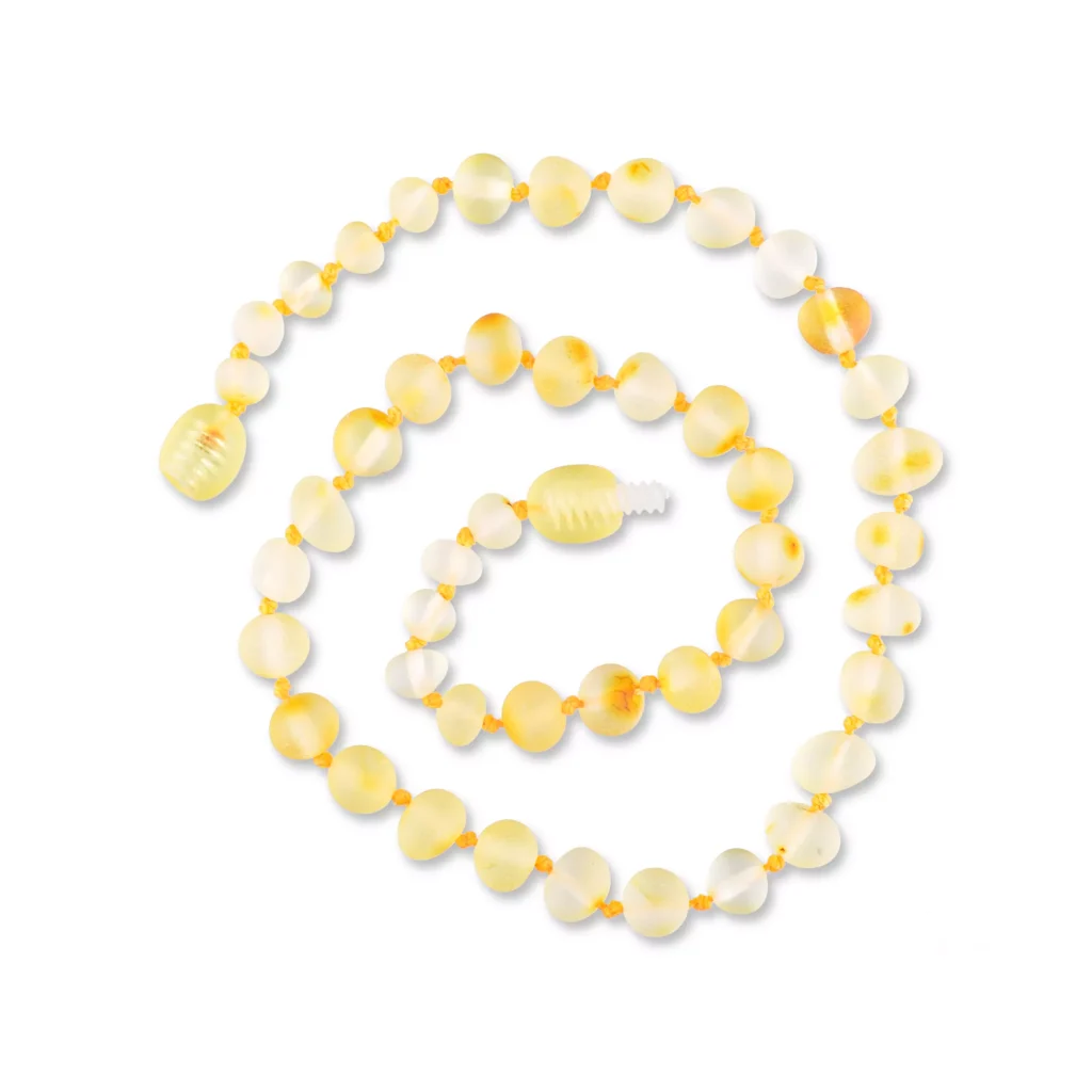 Handmade Baltic amber necklace with soft yellow beads and elegant spiral design for versatile wear.
