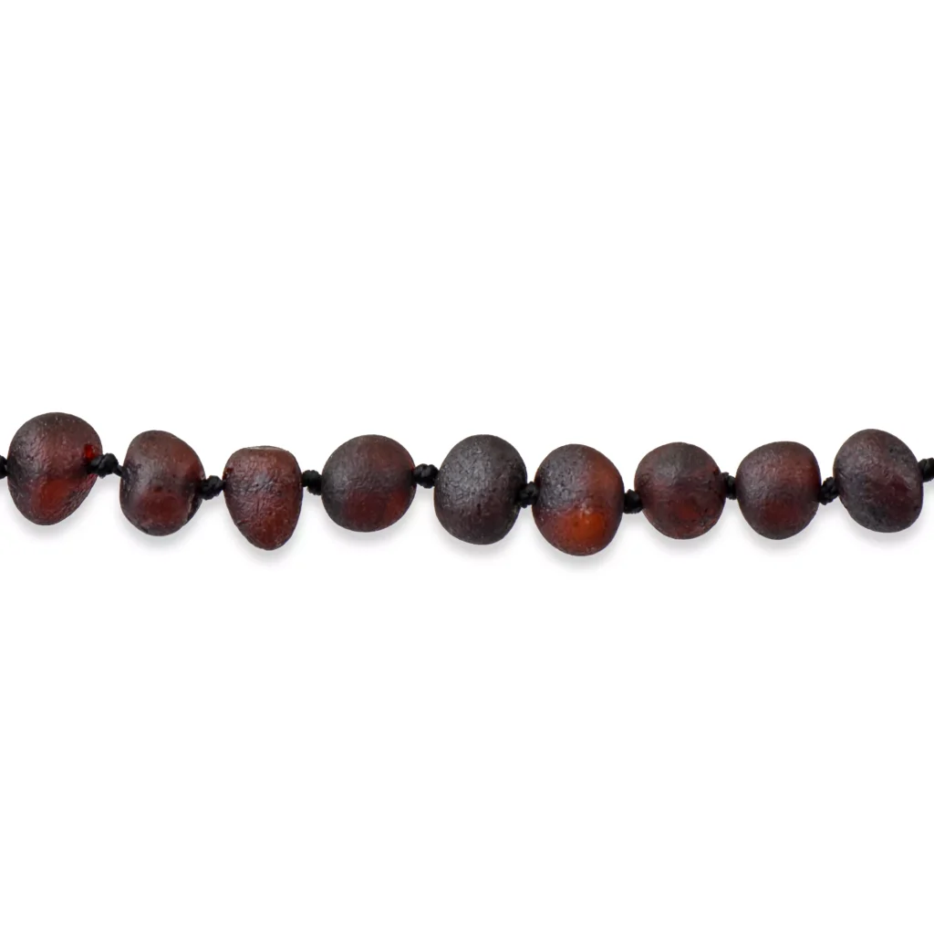 Handmade natural wooden bead necklace with earthy tones and organic, smooth pebble-like design.