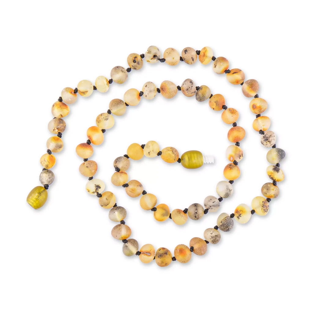 Beaded strand with earthy tones and vibrant green focal bead, handcrafted natural mineral jewelry.
