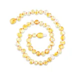 Elegant handmade amber and glass bead necklace with yellow and clear translucent accents.