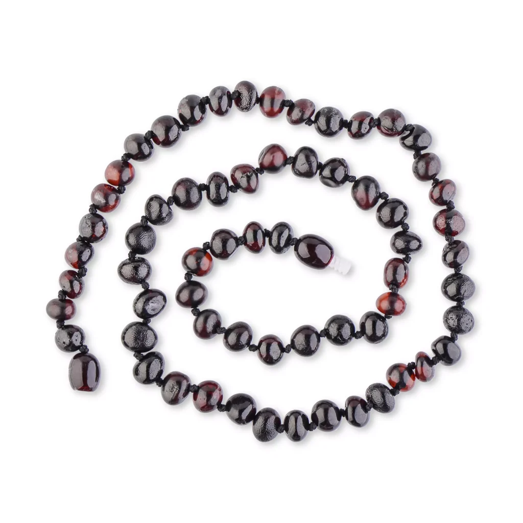 Handcrafted red and black beaded necklace with glossy, natural stone finishes for elegant style.