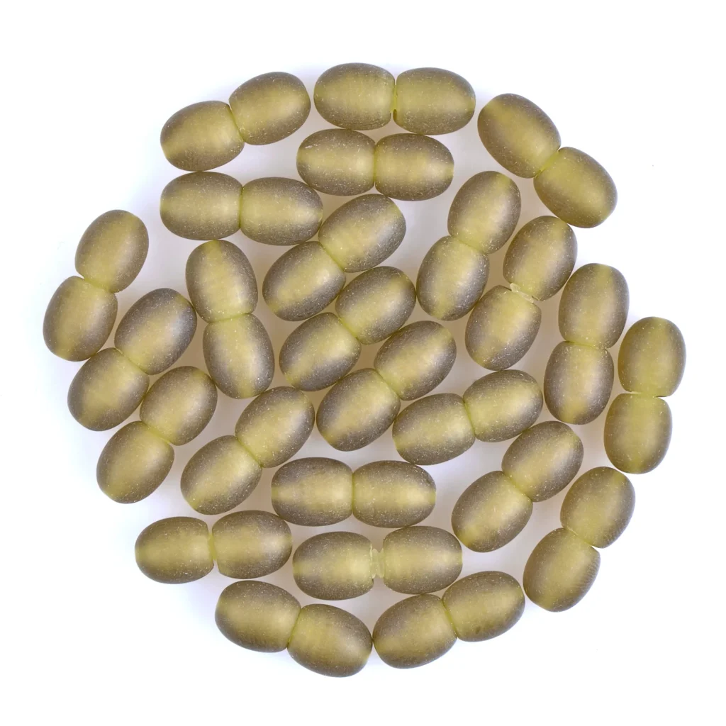Arranged greenish capsules in a neat, circular pattern, evoking natural wellness and dietary supplements.