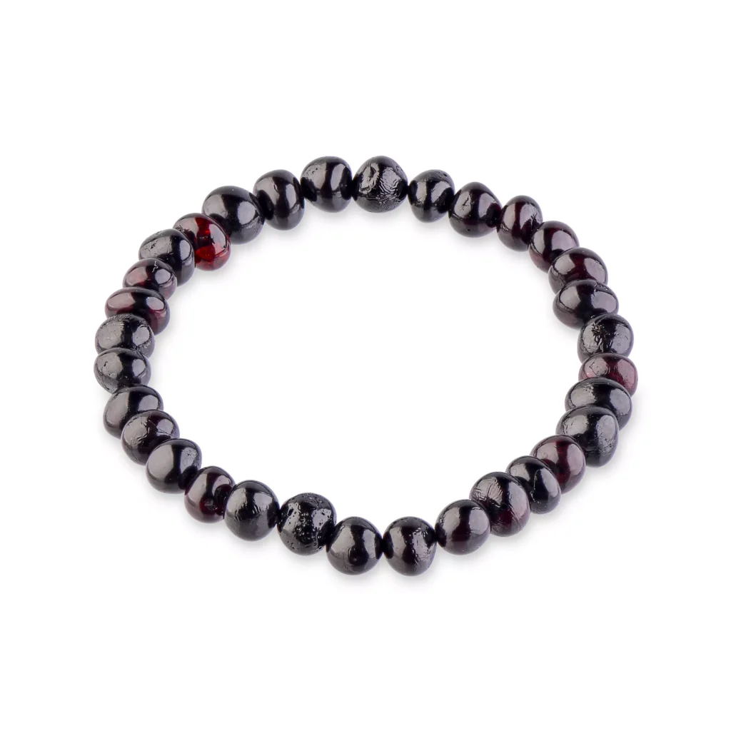 Elegant black beaded bracelet with polished onyx-like gemstones on elastic stretch band.