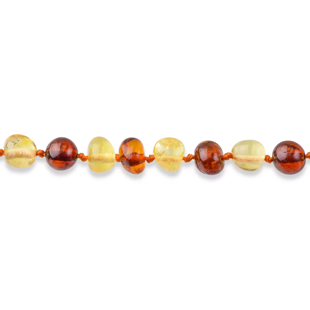 Handmade amber necklace with warm, earthy tones and polished, glossy beads in natural Baltic amber.