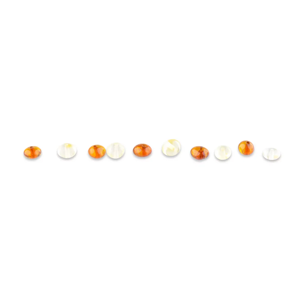 Line of polished amber beads with contrasting dark and light colors, elegant and handcrafted.