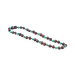 Handmade wooden and turquoise beaded necklace with Baltic amber accents, stylish and artisan-crafted jewelry.