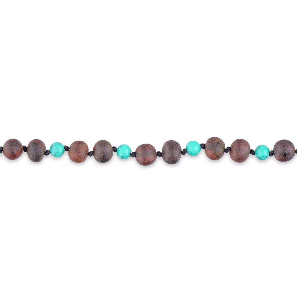 Elegant handmade necklace with wooden, turquoise beads, and black spacers for versatile style.