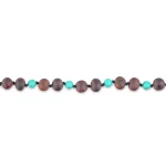 Elegant handmade necklace with wooden, turquoise beads, and black spacers for versatile style.