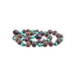 Beaded necklace with natural wood and vibrant turquoise beads, handmade, stylish, and versatile accessory.