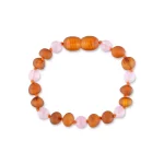 Handmade amber and pink beaded bracelet with warm tones and textured, glossy accents.