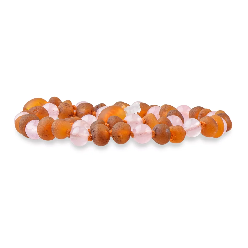 Colorful amber and pink beaded jewelry strand with glossy, handcrafted glass or resin beads.