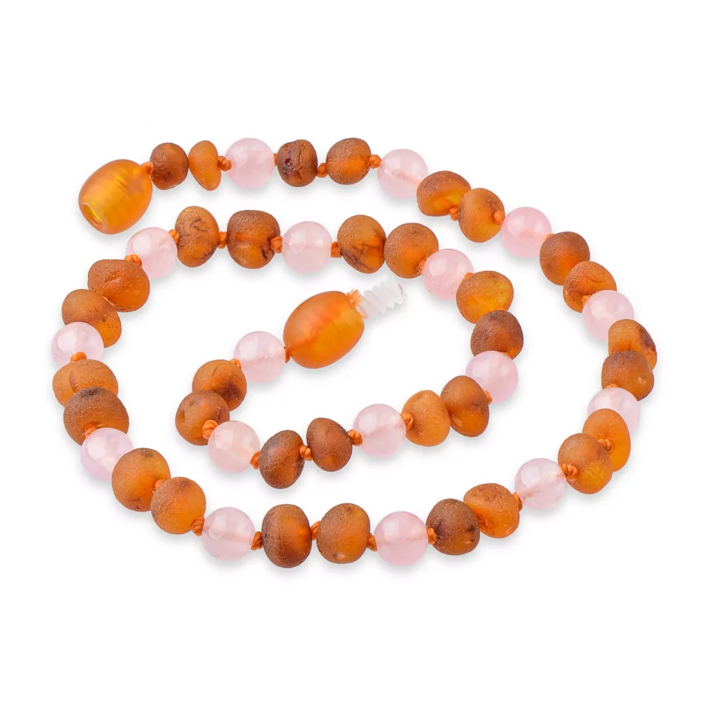 Handmade amber and pink bead necklace with warm tones and organic, elegant design.
