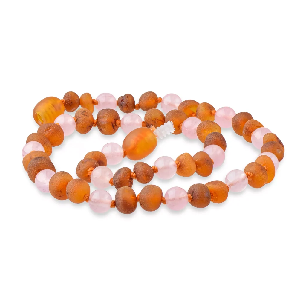 Beautiful amber and pink beaded necklace with elegant craftsmanship and natural materials.