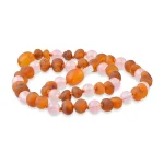 Beautiful amber and pink beaded necklace with elegant craftsmanship and natural materials.