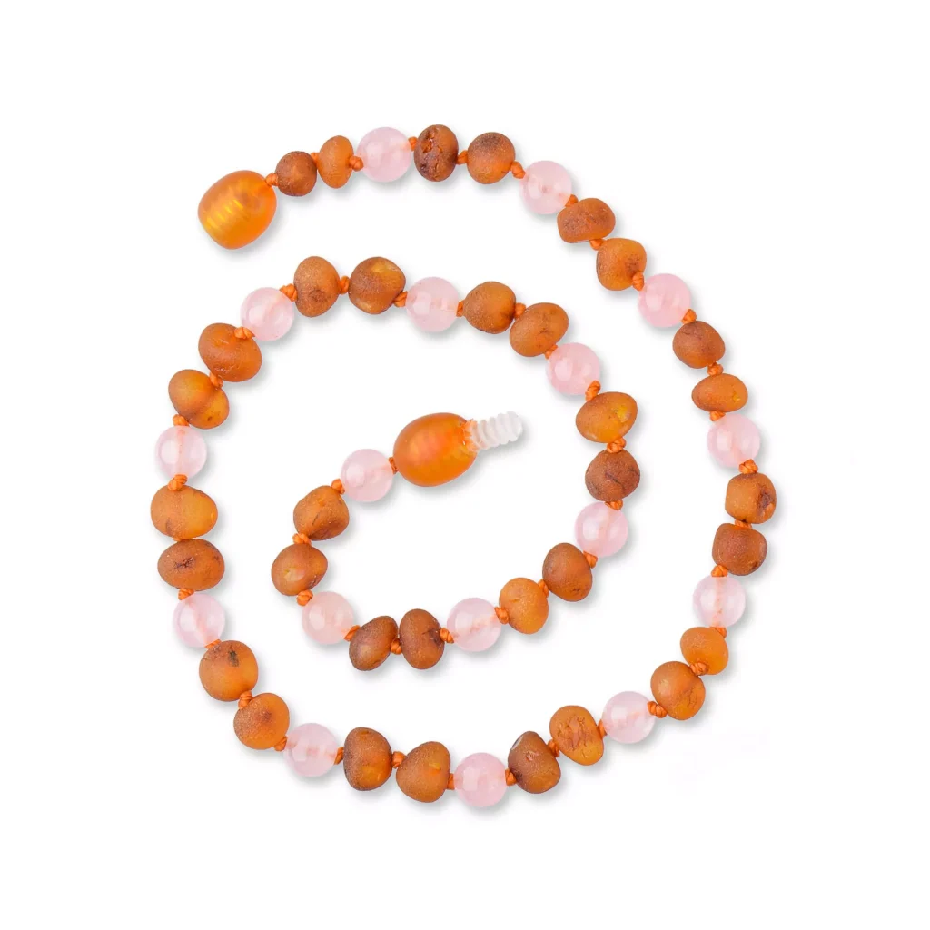 Handmade amber and pink bead necklace with focal amber center and handcrafted charm.