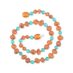 Handcrafted Baltic amber and turquoise necklace with warm tones and vibrant accents.