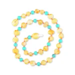 Beautiful amber and turquoise beaded necklace with natural, warm, and vibrant stone accents.