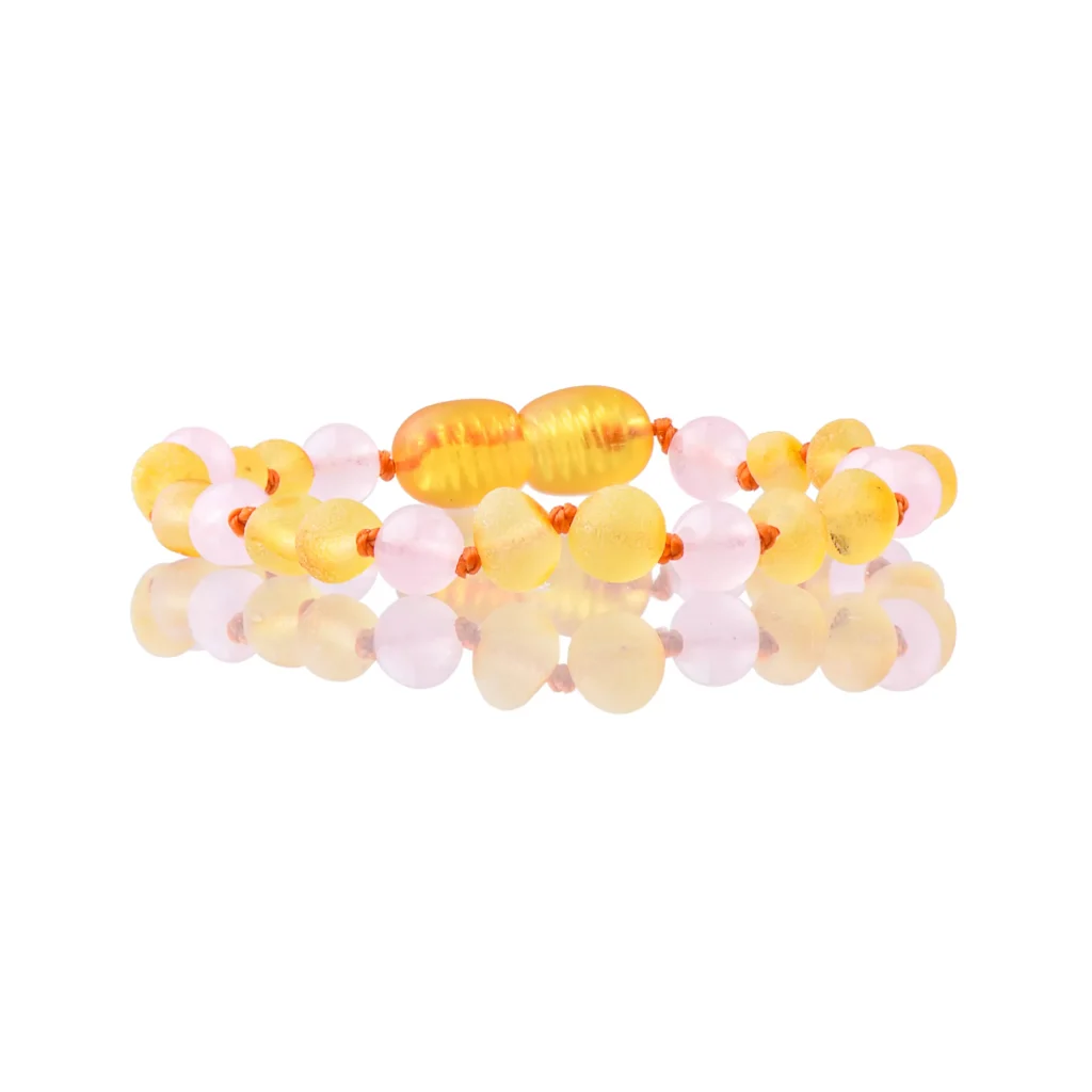 Colorful pastel beaded bracelet with translucent amber and rose quartz accents, handcrafted elegance.