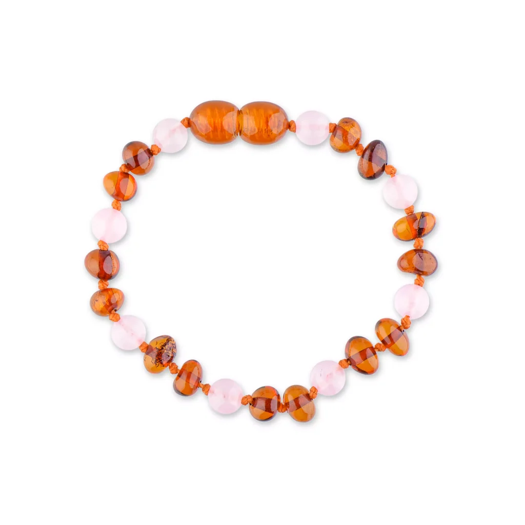 Handmade amber and pink beaded bracelet with natural, artisanal craftsmanship and warm, cheerful colors.